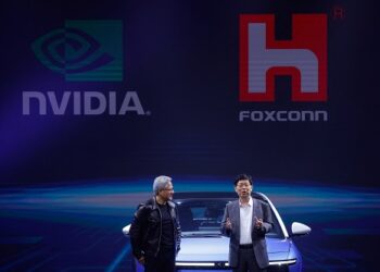 Foxconn Chairman Liu Young-way and Nvidia Corp CEO Jensen Huang speak during Foxconn's annual Tech Day in Taipei